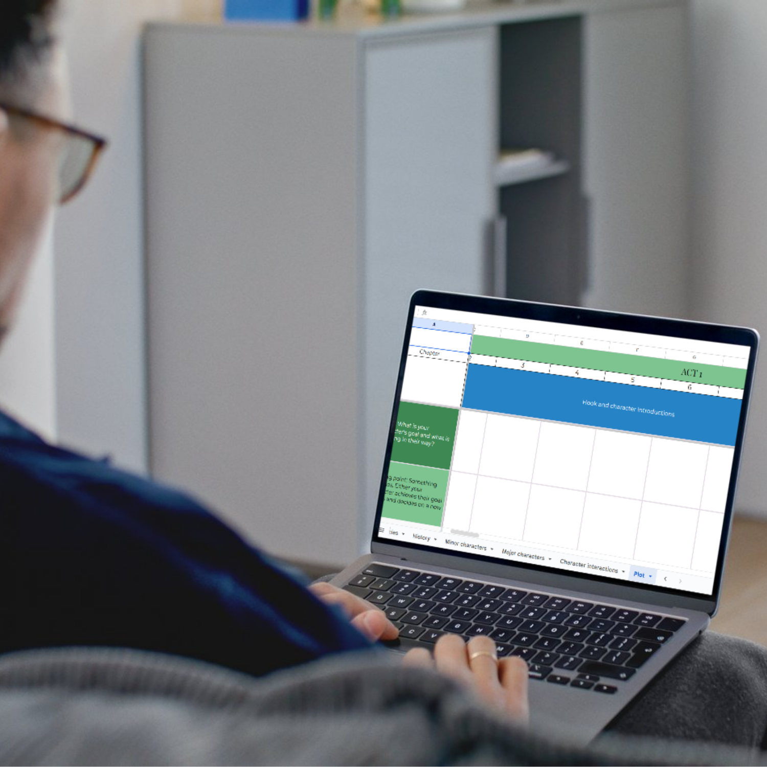 Person using the book compass novel tracker on a laptop
